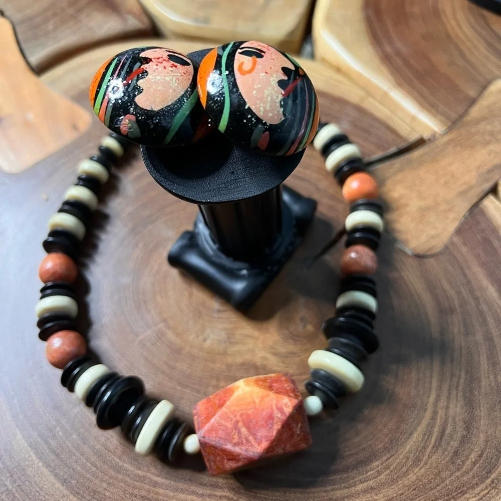 Three piece, rust and black stone and beaded costume jewelry.
